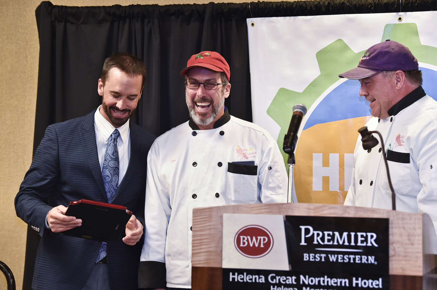 Jason Davis, left, awards the owners of Chili O'Brien's
